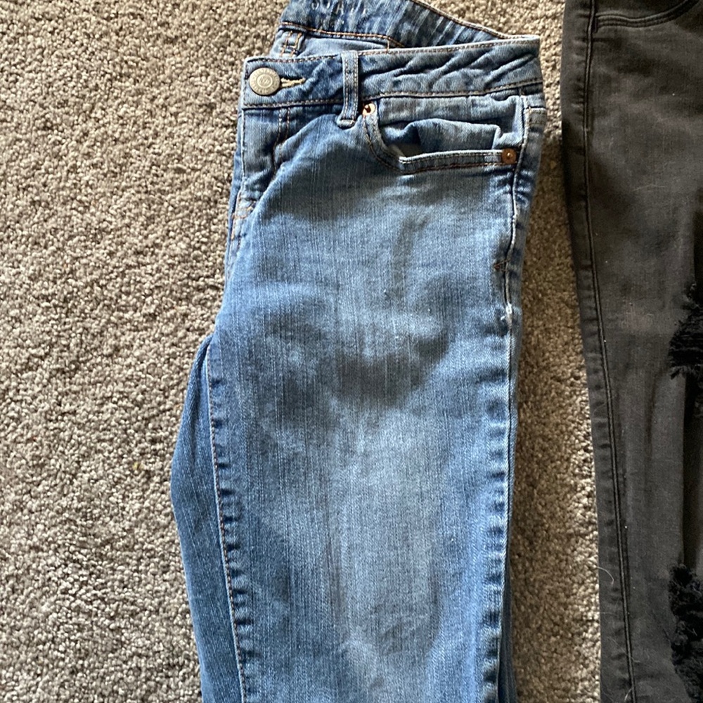 used blue jeans slight wear n tear